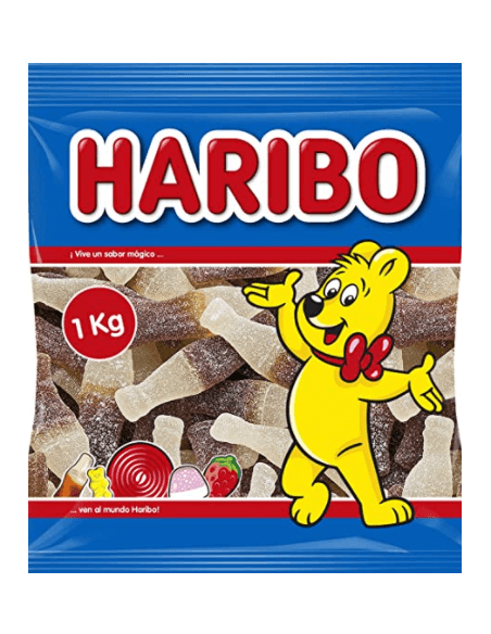 Gominolas de pica HARIBO con forma de botellas sabor cola. La bolsa contiene 1 kg de chuches.